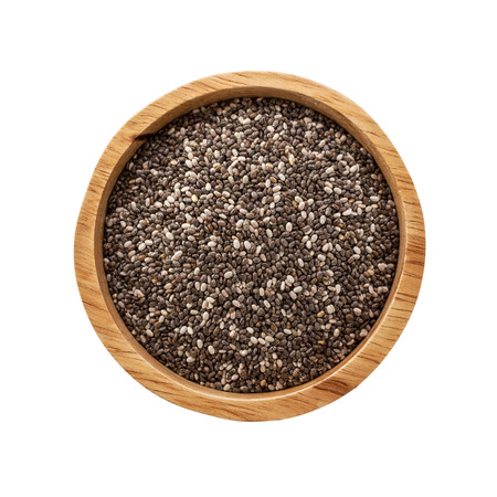 Chia seeds in wooden bowl isolated on white backgroundの写真素材