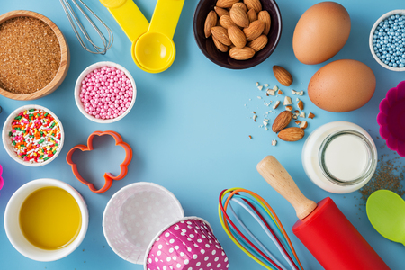Baking background with ingredients and cake decor and kitchen tools for baking cakeの写真素材