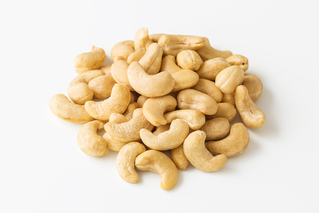 Raw cashew nuts on white backgroundの写真素材