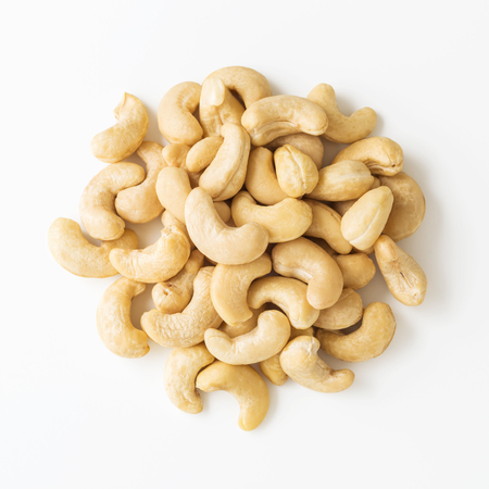 Raw cashew nuts on white background top viewの写真素材