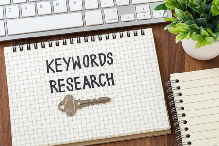 Keywords research for seo concept on wooden deskの写真素材