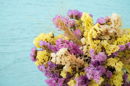 Flowers on blue wooden table backgroundの写真素材