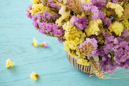 Bouquet of flowers on blue wooden tableの写真素材