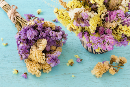 Bouquet of flowers on blue wooden tableの写真素材