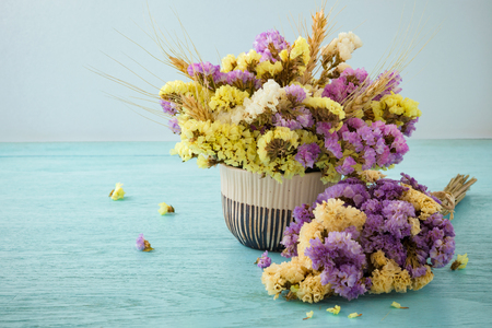 Bouquet of flowers on blue wooden table backgroundの写真素材