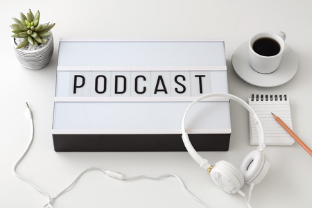 Podcast word on lightbox with headphones, podcast conceptの写真素材