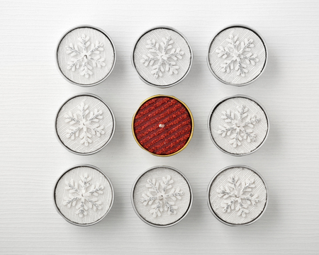 White and red christmas candles on white table, top viewの写真素材