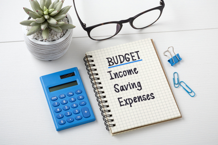 Budget planning concept with calculator on white tableの写真素材
