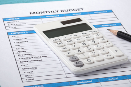 Monthly budget concept with white calculatorの写真素材