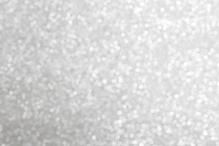 Silver bokeh background, defocused glitterの写真素材