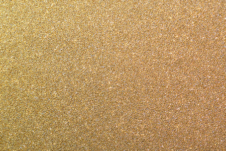 Gold glitter background, shiny christmas wrapping paper textureの写真素材