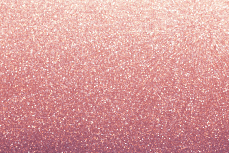 Pink gold glitter bokeh background, shiny wrapping paper defocusedの写真素材