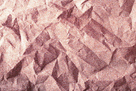 Rose gold glitter background, shiny crumpled wrapping paper texture, pink champagneの写真素材