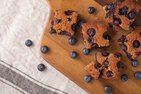 Blueberry square bars on wooden board with blueberries, paleo low carb dessertの写真素材