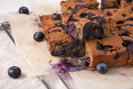 Blueberry square bars on baking sheet, paleo healthy baking with almond flour and shredded coconutの写真素材