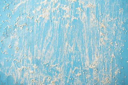 Quinoa flour with quinoa seeds on blue wooden background, top viewの写真素材