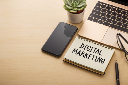 Laptop and smart phone on wooden background, digital strategy and marketing conceptの写真素材