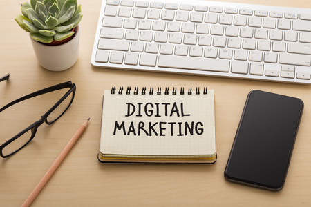 Digital marketing and strategy concept with smart phone on office deskの写真素材