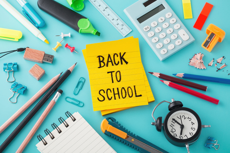 Back to school concept with school supplies on blue backgroundの写真素材