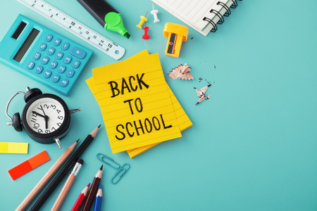 Back to school word on note with school supplies on blue backgroundの写真素材