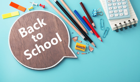 Back to school concept with school stationery on blue background with copy spaceの写真素材