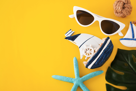 Summer holiday travel concept on yellow backgroundの写真素材