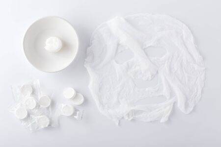 Facial mask, DIY sheet mask compressed on white backgroundの写真素材