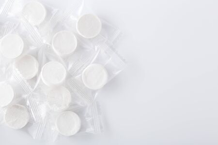 Compressed facial mask, dry sheet mask in package on white backgroundの写真素材