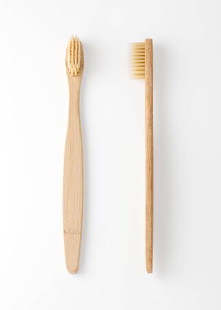 Bamboo toothbrush isolated on white backgroundの写真素材