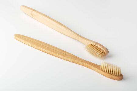 Wooden toothbrushes on white backgroundの写真素材