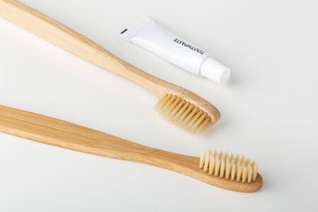 Toothbrushes with toothpaste, travel size, on white backgroundの写真素材