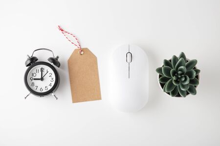 Computer mouse, clock and sale tag on white desk, online sale, cyber monday, flat layの写真素材