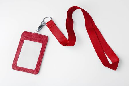 Red lanyard and leather badge, mock up on white backgroundの写真素材