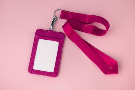 Leather badge and lanyard on pink backgroundの写真素材