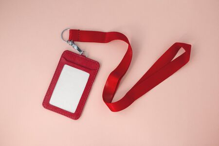 Red lanyard and leather badge, top viewの写真素材