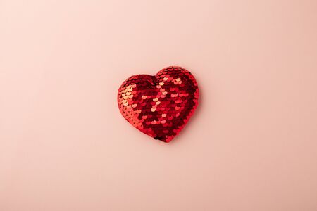 Red glitter heart on pink background, love, valentines day, minimal, flat layの写真素材