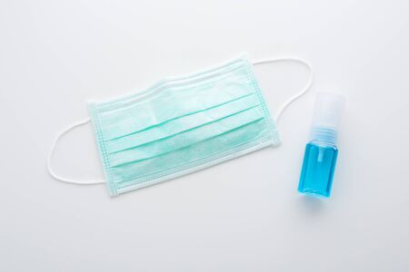 Coronavirus, 2019-ncov protection mask and alcohol spray for hand hygiene, top viewの写真素材