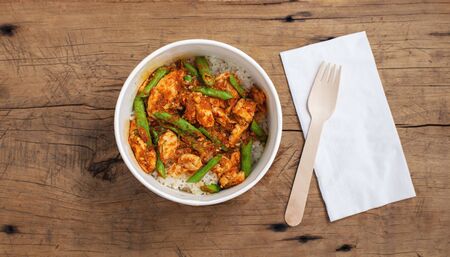 Stir fried chicken with vegetable asian street  food in food paper box, top viewの写真素材