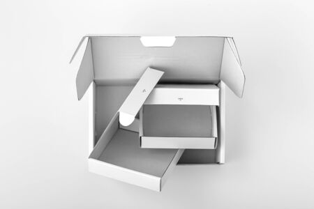 Opened empty white packaging boxes with different size, top viewの写真素材