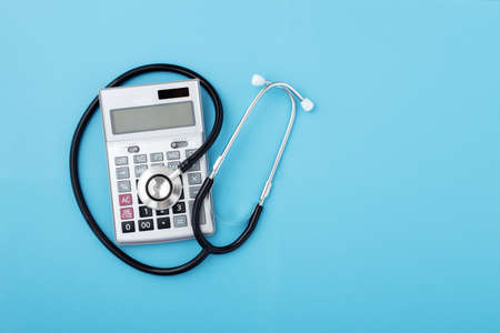 Health insurance claim form with stethoscope and surgical mask, top viewの写真素材