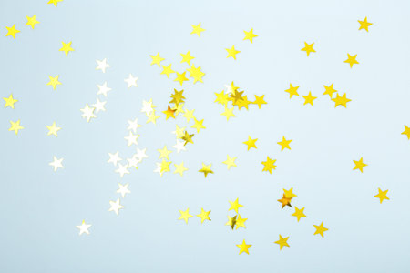 Gold glitter sparkle star on blue background