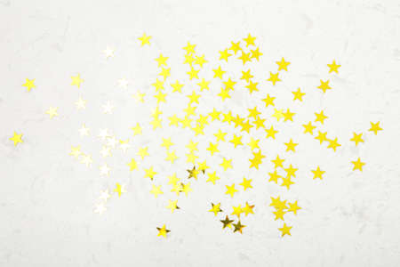 Gold glitter sparkle star on marble backgroundの写真素材