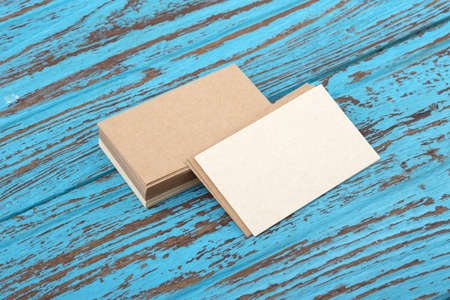 Kraft business card mockup on blue wooden tableの写真素材