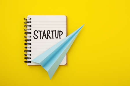 Startup business concept on yellow background, copy spaceの写真素材