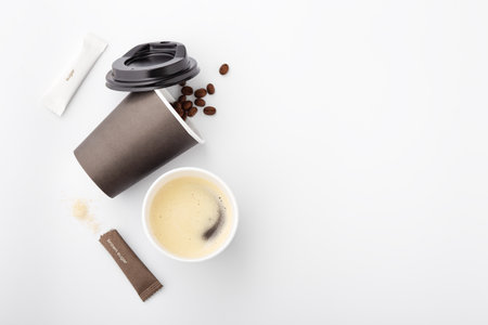 Black coffee with brownie and sugar on yellow background, coffee time, top viewの写真素材