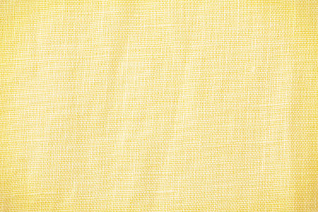 Yellow linen fabric cloth texture background, top viewの写真素材