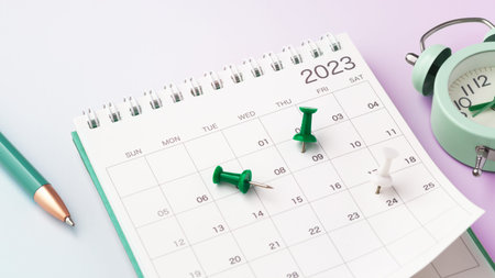 Scheduling and planning concept, calendar with green pin and clock on gradient background