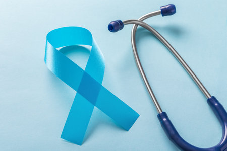 Blue ribbon with stethoscope, prostate cancer awareness month on light blue backgroundの写真素材