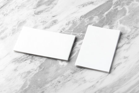 White business card mockup on marble table backgroundの写真素材