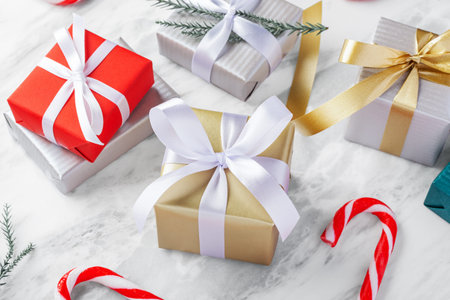 Gift boxes on marble table with christmas decoration